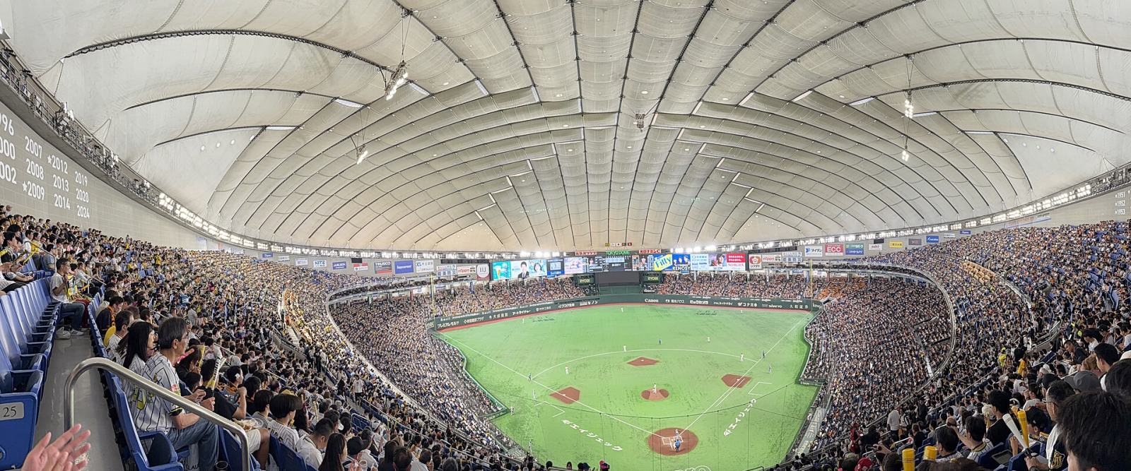 A packed stadium during a professional baseball game