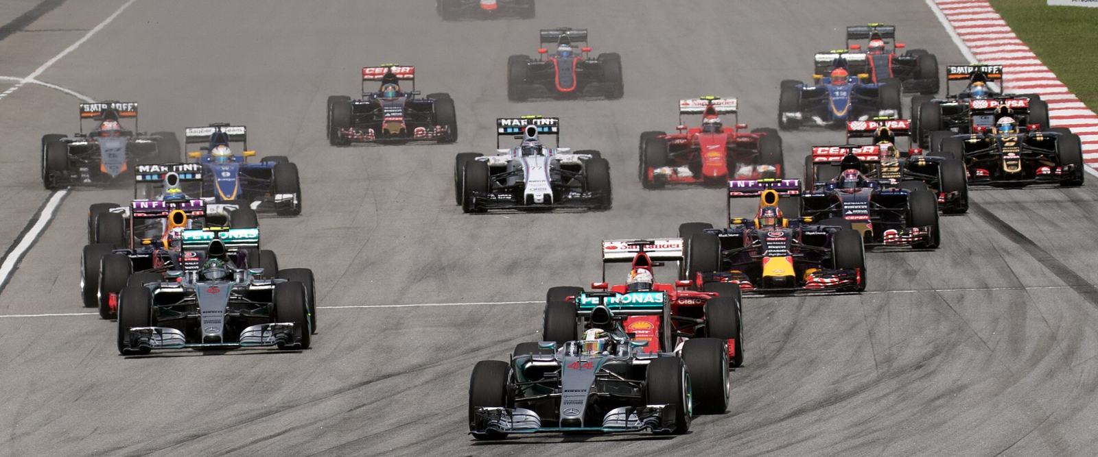 Formula One cars running as a pack through the opening lap of a grand prix
