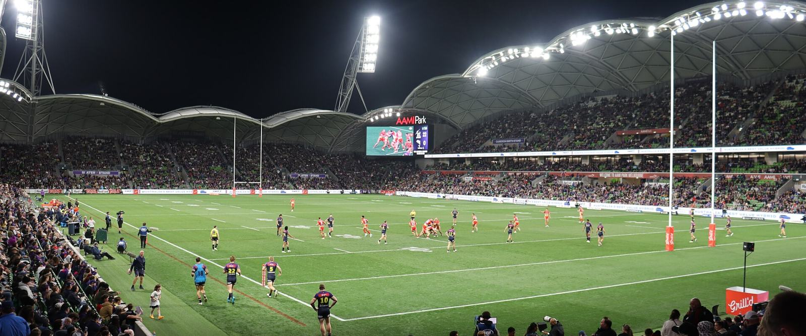 A rugby league match under lights at AAMI Park